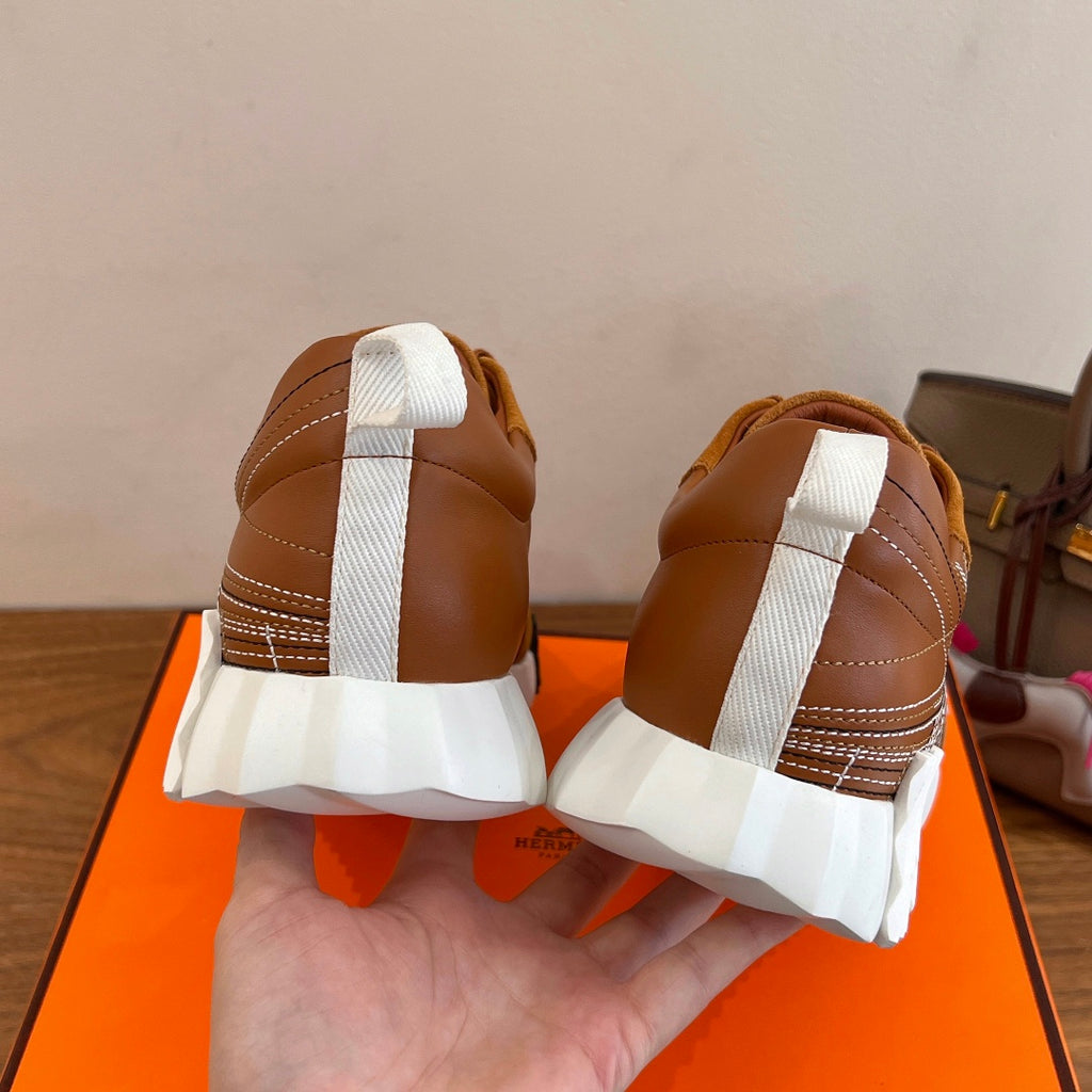 Hermes unisex sneakers back view with white heels and tan suede uppers, lace-up