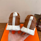 Hermes unisex sneakers back view with white heels and tan suede uppers, lace-up