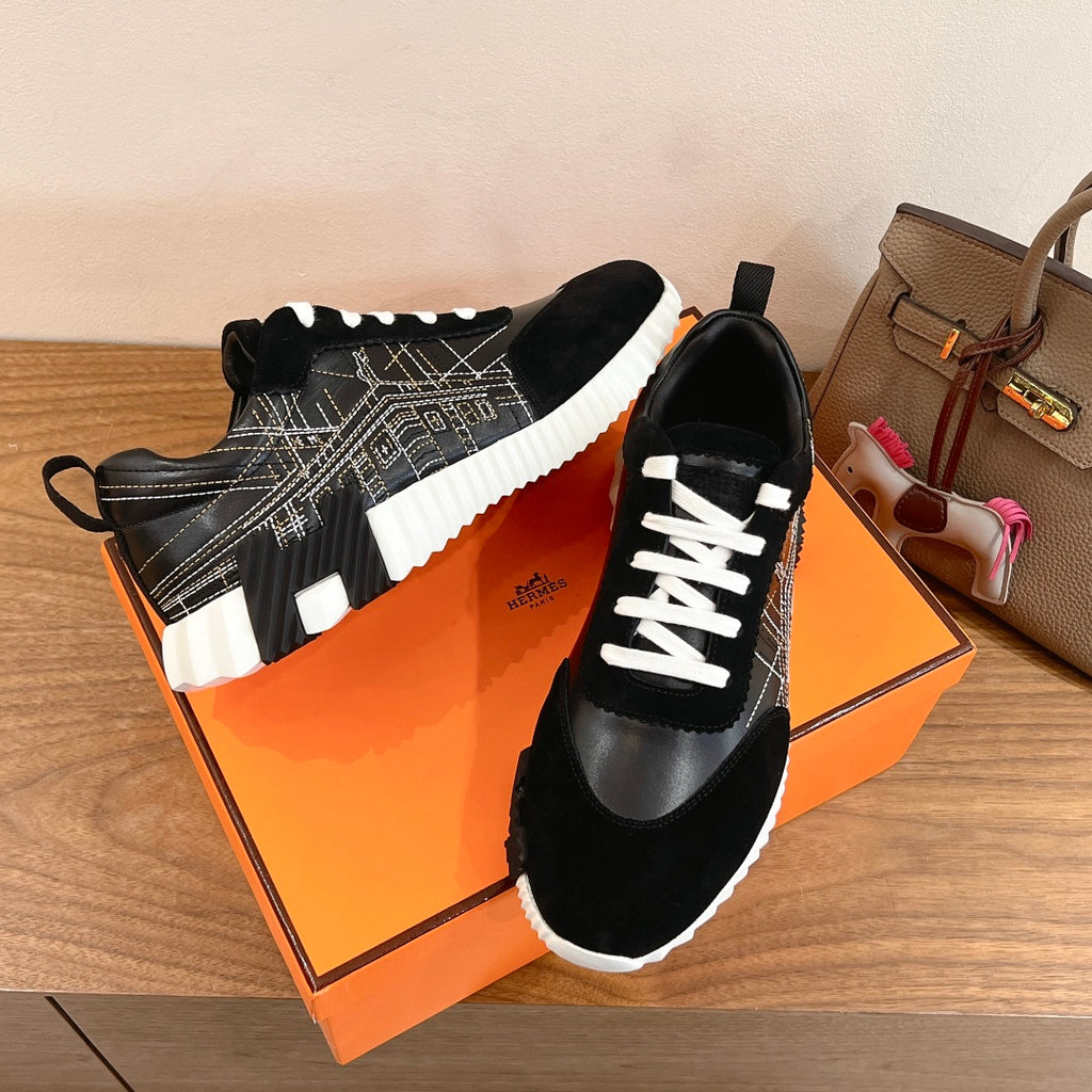 Black Hermes unisex sneakers with white laces, geometric side stitching, cushioned sole