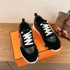 Black Hermes unisex sneakers with white laces and side black leather overlays