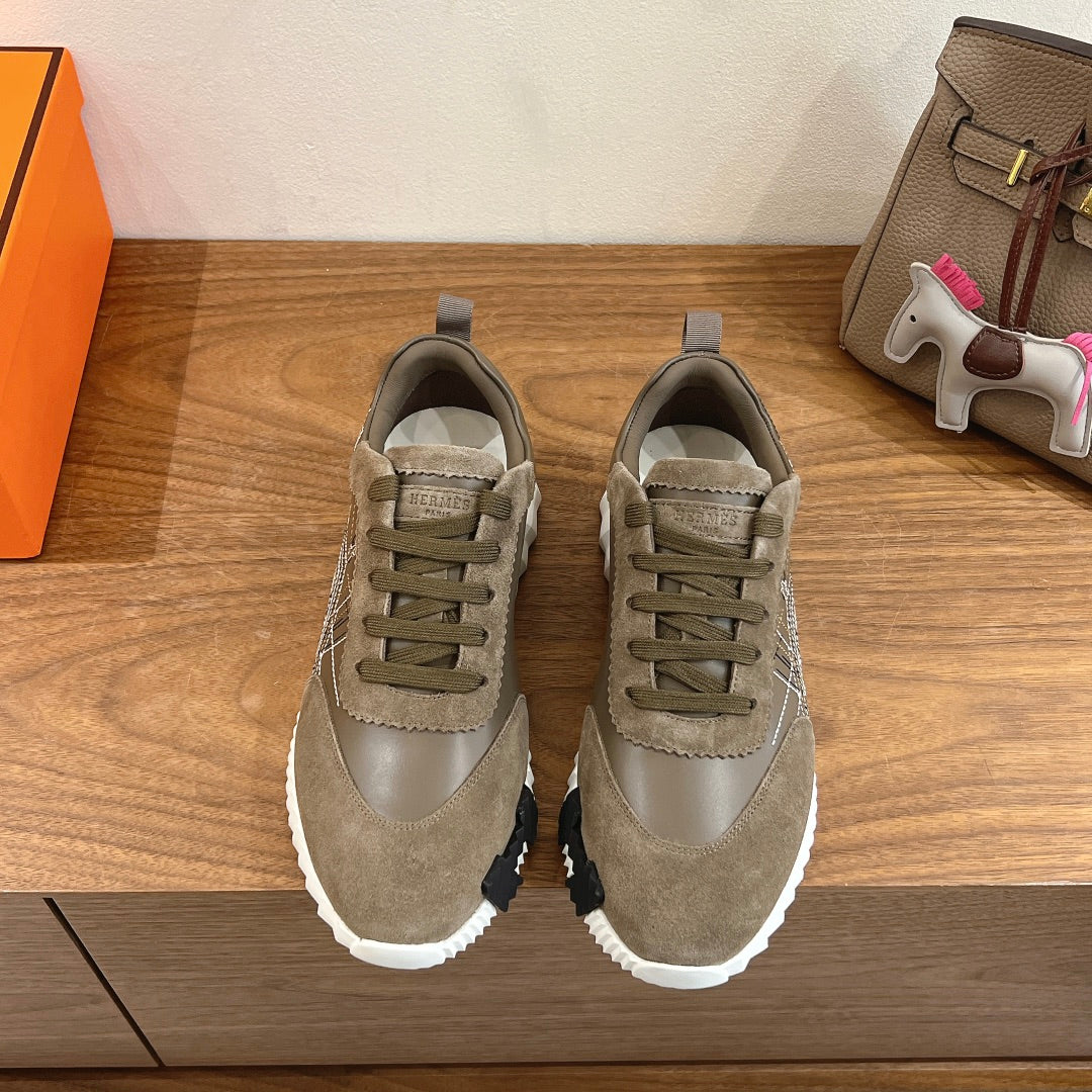 Hermes unisex sneakers in olive suede with lace-up front and white rubber sole