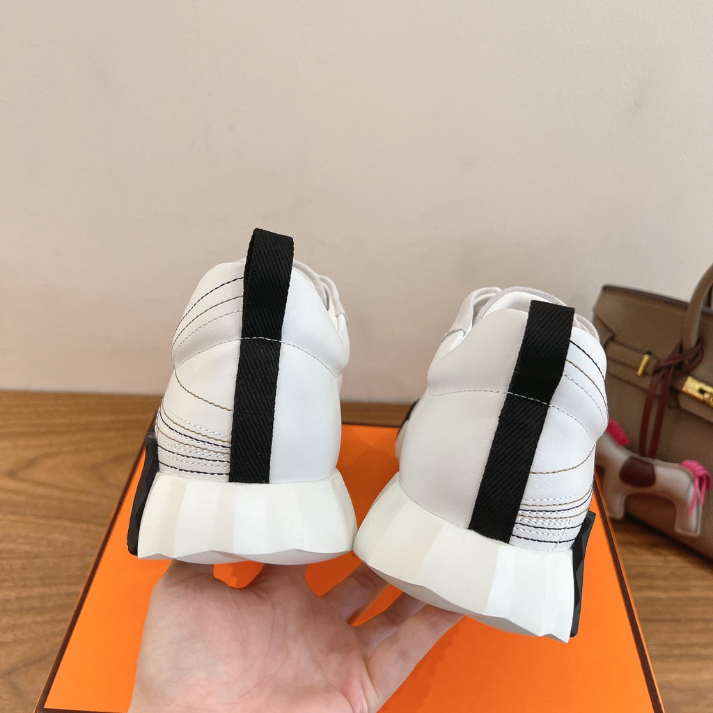 Hermes unisex sneakers, back view with black heel strap and cushioned sole