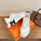 Hermes unisex sneakers, white with black logo-style accents and white laces
