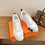 Hermes unisex sneakers, white lace-up with black outsole and cushioned sole