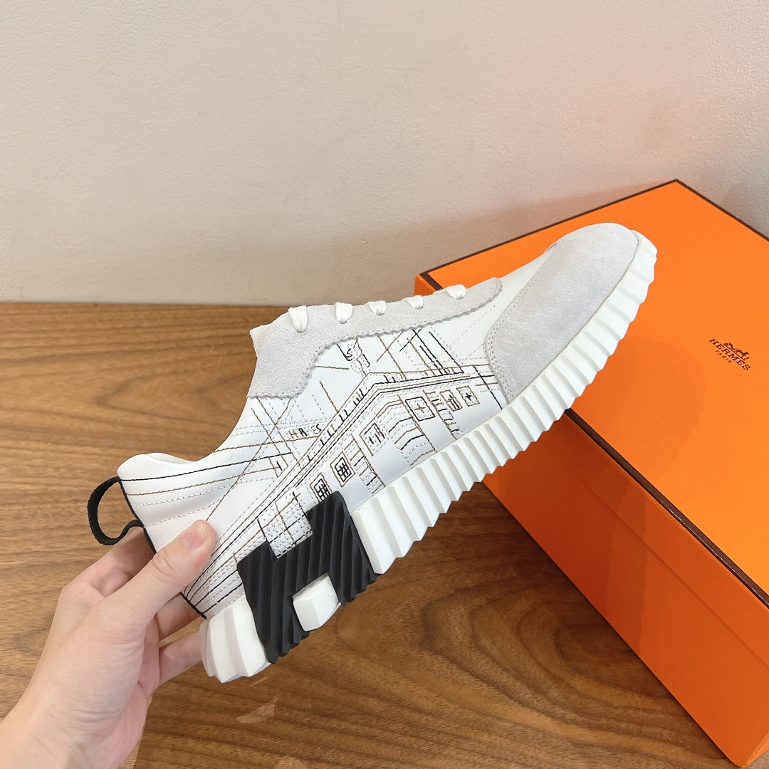 Hermes unisex sneakers, close-up white upper with black graphic and thick sole