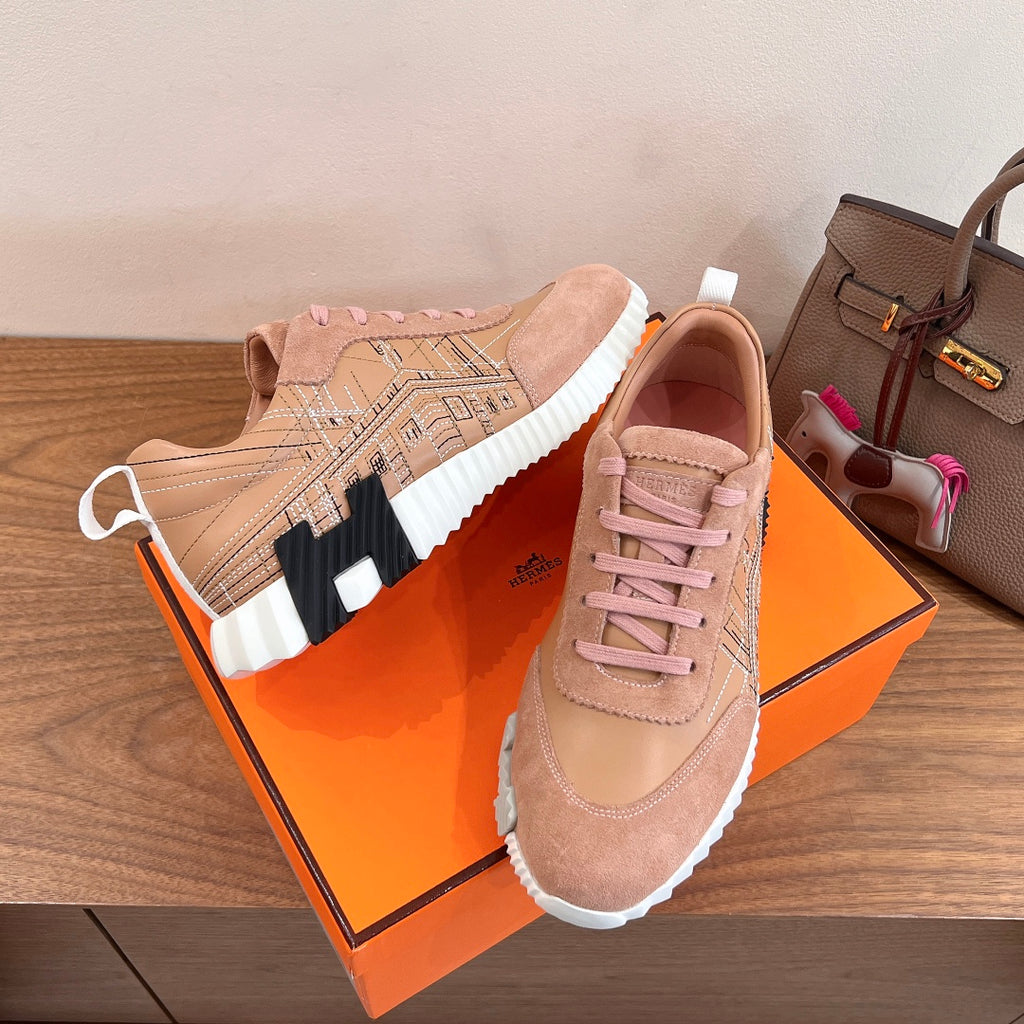 Hermes unisex sneakers in light pink suede with pink laces, white sole, and side logo