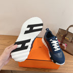 Unisex blue sneakers with white sole; outsole shows black traction tread