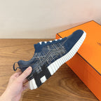 Unisex blue low-top sneakers with white laces and textured patterned side