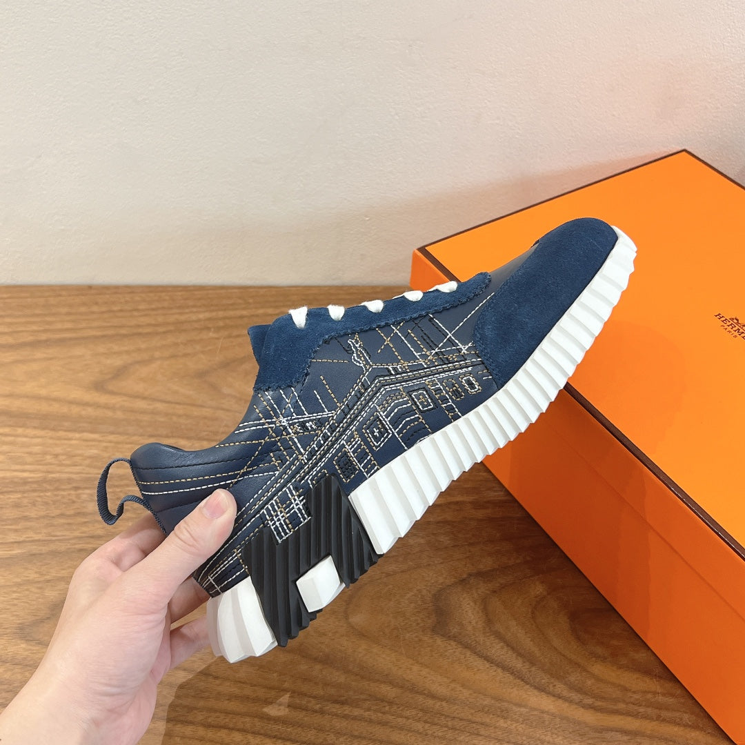 Unisex blue low-top sneakers with white laces and textured patterned side