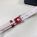Red belt with silver buckle hardware and light strap lining, shown from side