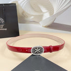 Red leather belt with silver round filigree buckle and metal eyelets