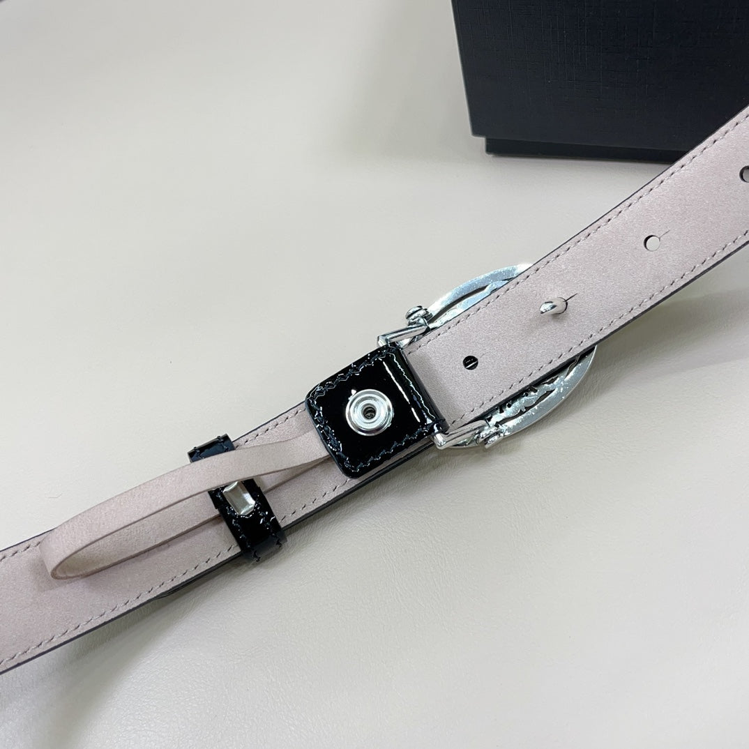 Chrome belt back view: dark buckle hardware on light strap with metal rivets and holes