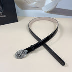 Chrome belt with dark strap and ornate silver oval buckle, shown laid in a loop