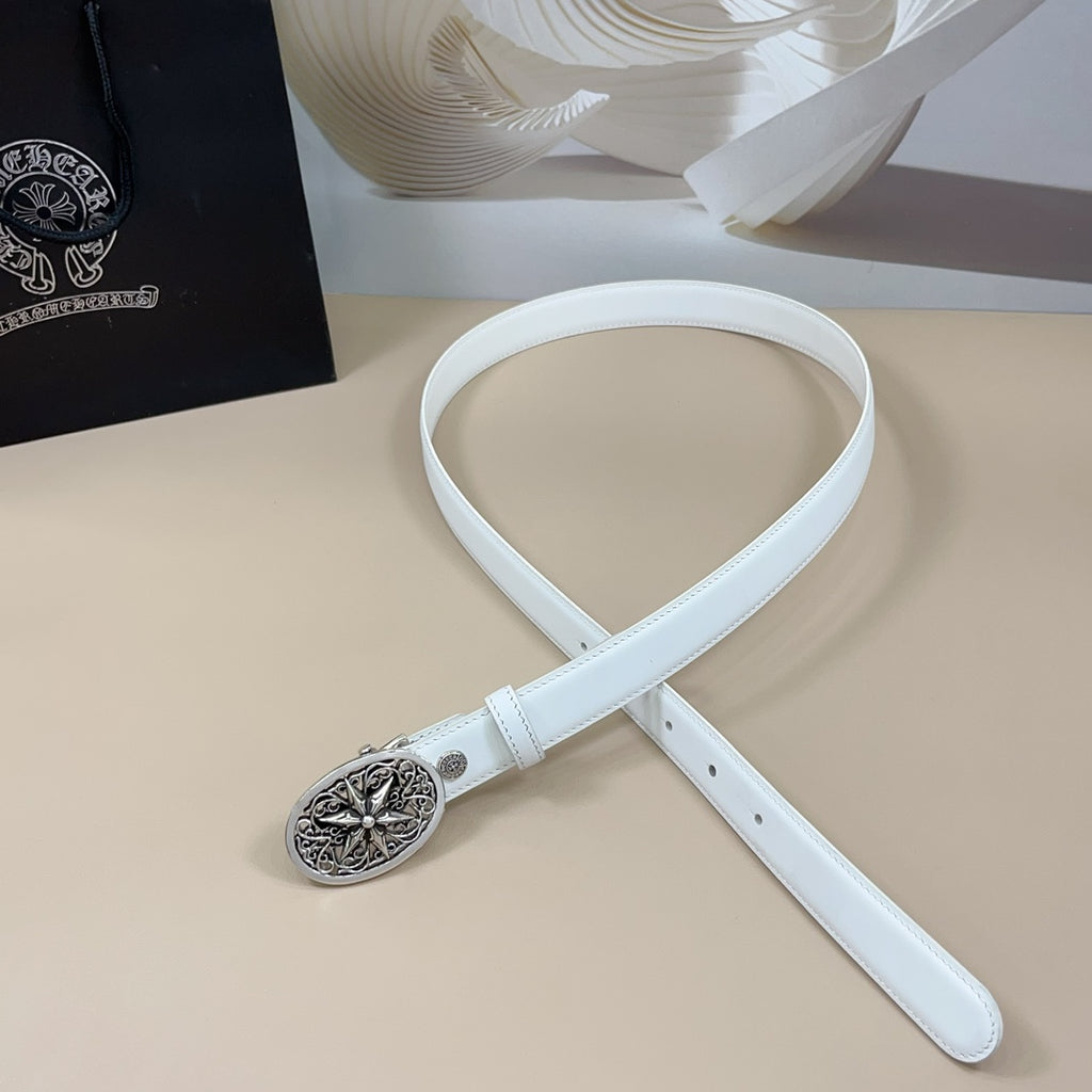 White leather belt with round ornate silver buckle and adjustable belt end