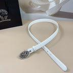 White leather belt with round ornate silver buckle and adjustable belt end