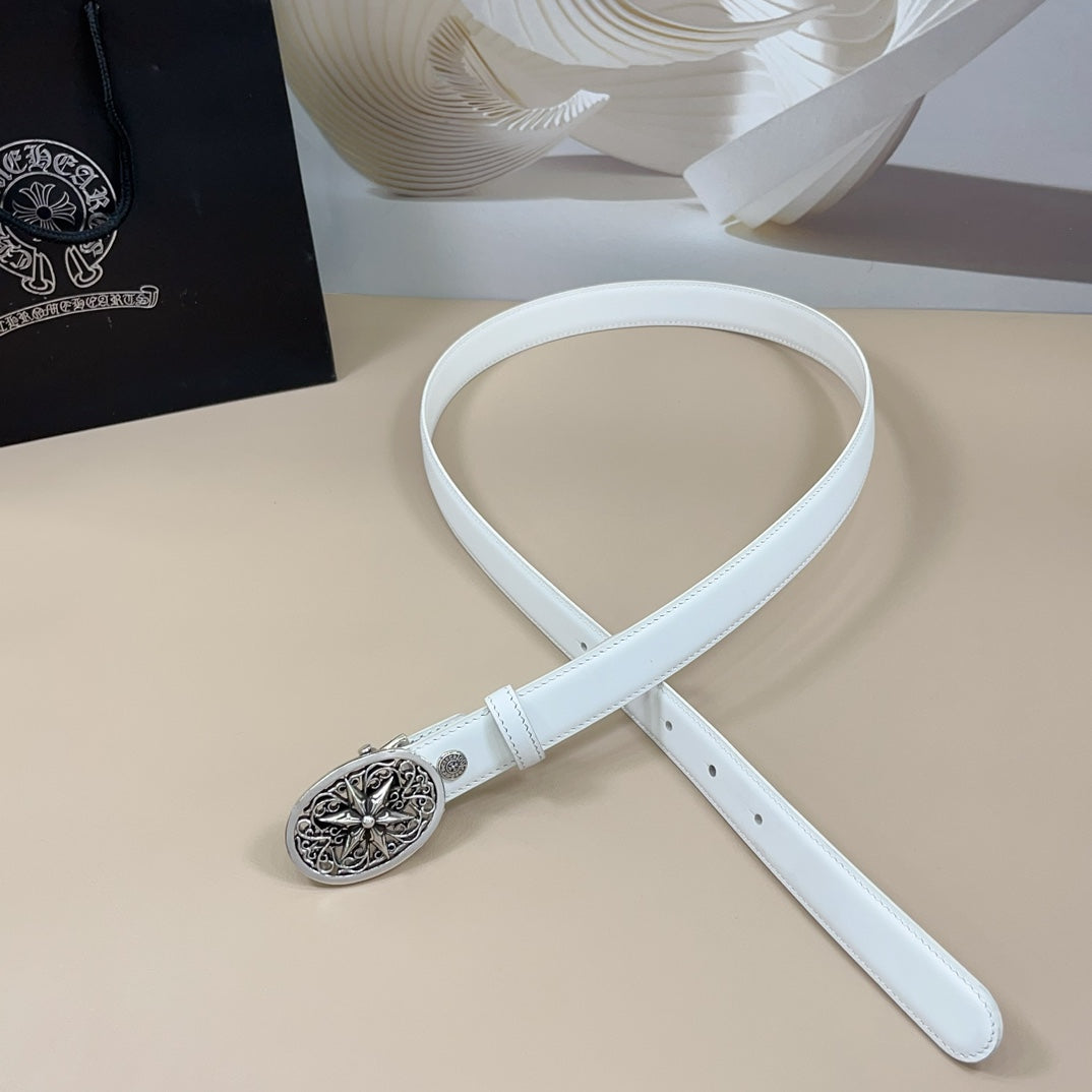 White leather belt with round ornate silver buckle and adjustable belt end