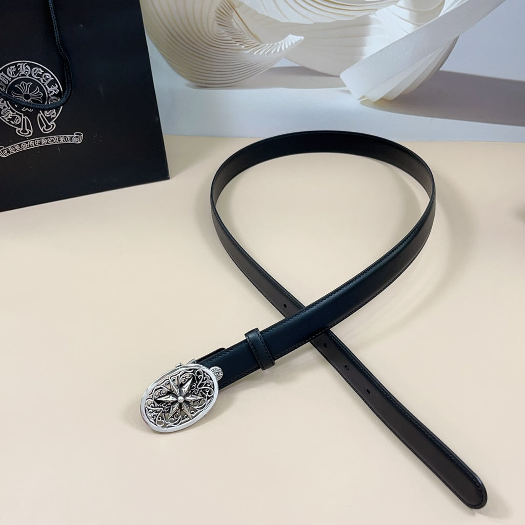 Navy leather belt laid flat with silver ornate oval buckle and keeper