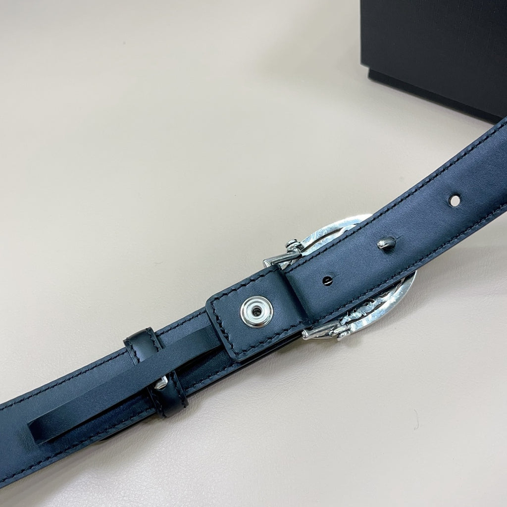 Navy belt close-up showing adjustment holes and metal clasp hardware