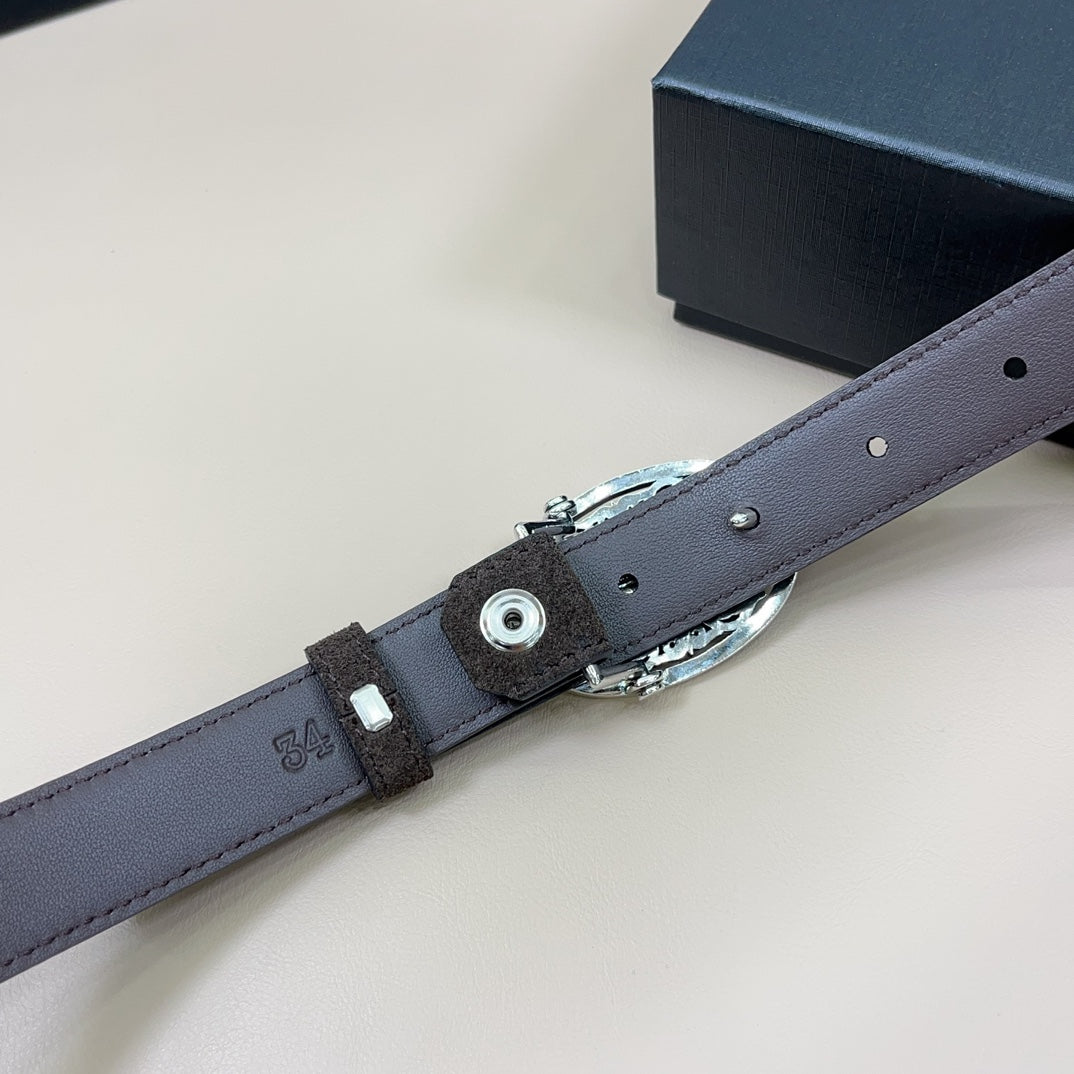 Dusty blue belt with oval silver buckle, metal eyelet and adjustable strap