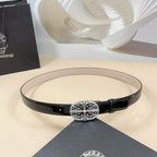 Black patent leather belt with oval silver filigree buckle and center gemstone