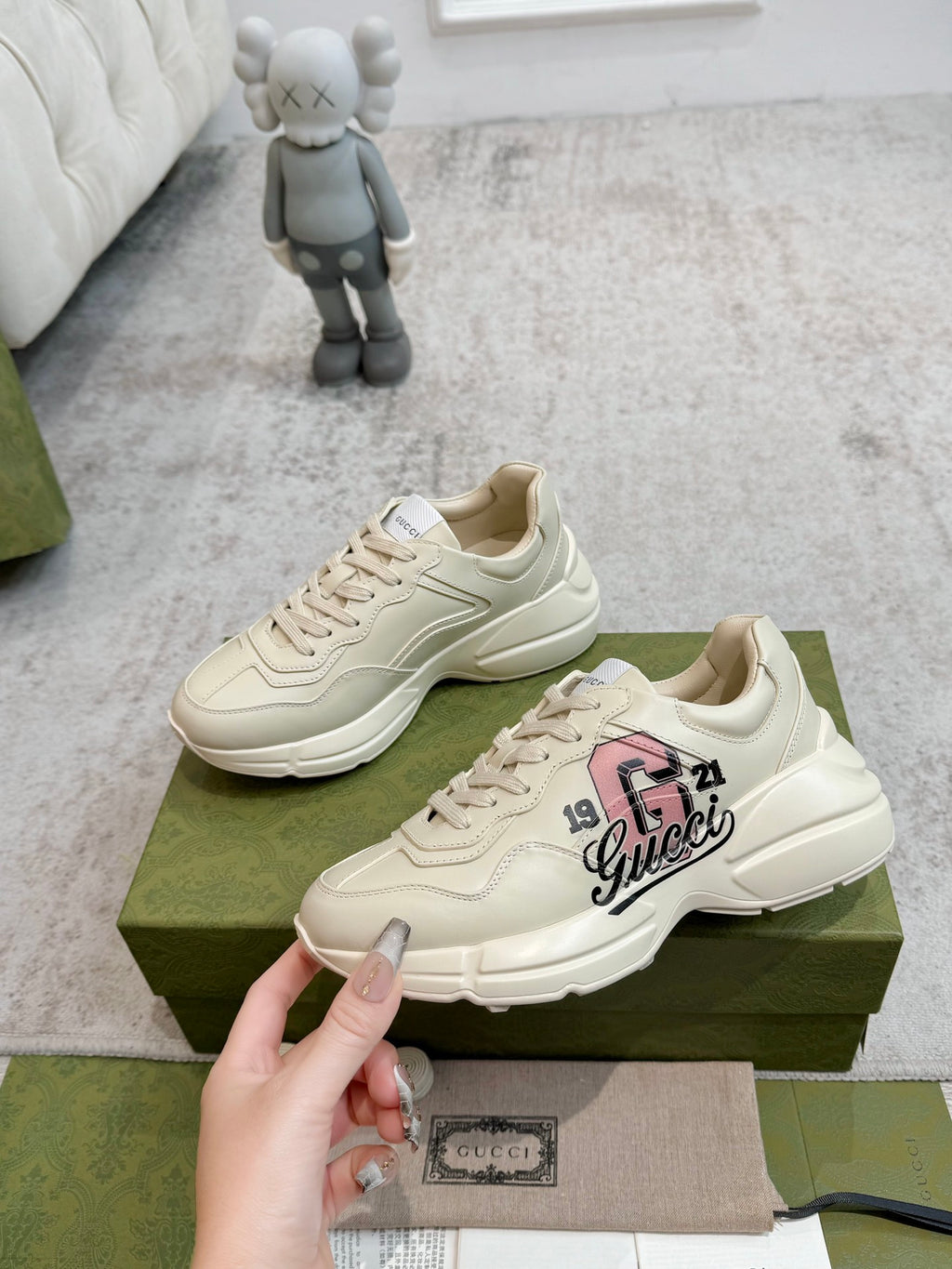 Light beige lace-up sneakers with Gucci logo and thick rubber sole