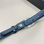 Navy leather belt with adjustable buckle hardware, visible eyelet and metal prong