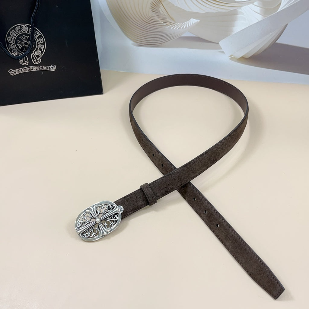 Brown leather belt with silver filigree oval buckle, styled across the image.