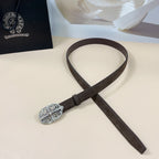 Brown leather belt with silver filigree oval buckle, styled across the image.