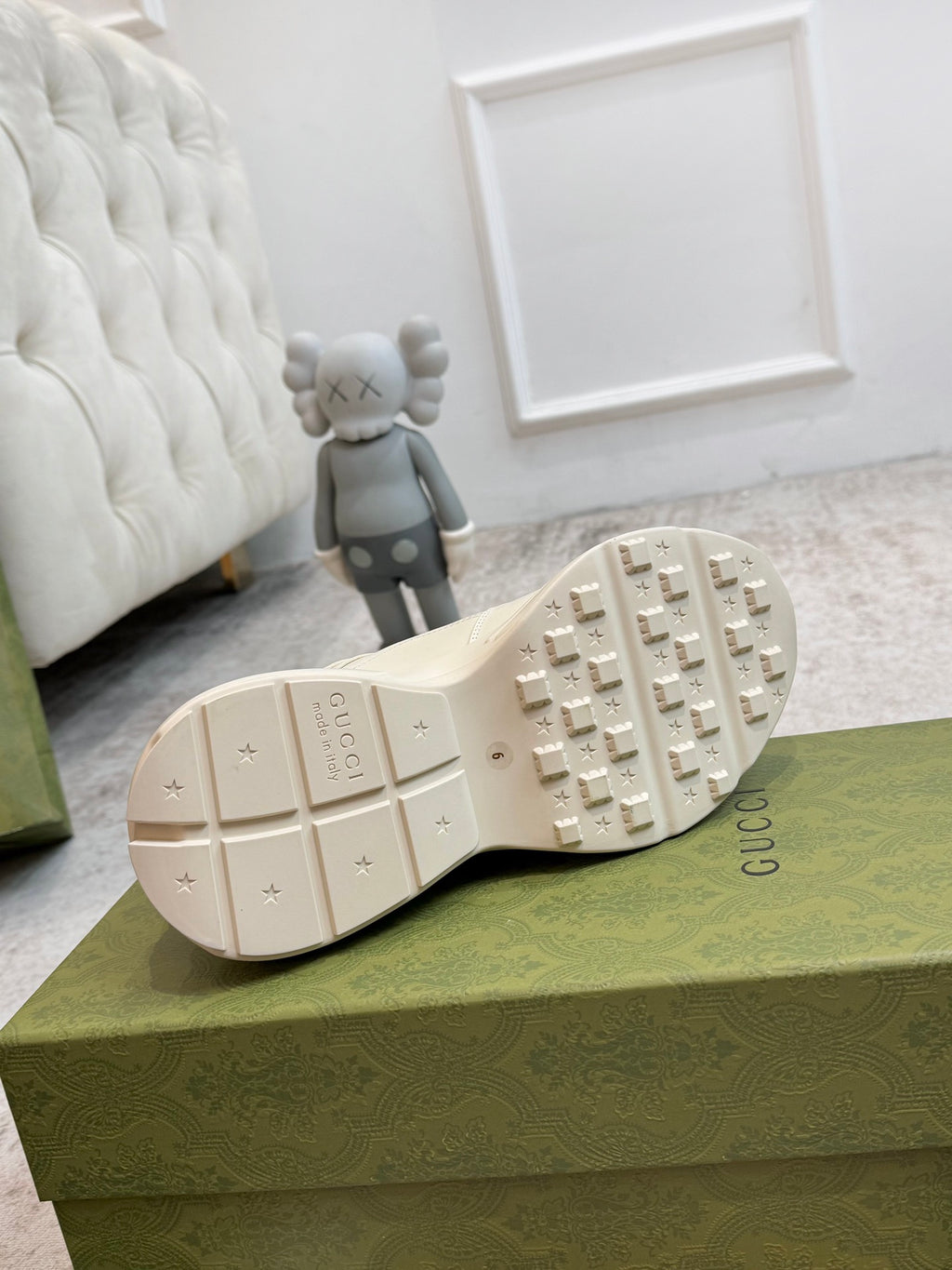 Gucci unisex sneakers outsole view in cream with tread pattern and Gucci mark