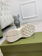 Gucci unisex sneakers outsole view in cream with tread pattern and Gucci mark