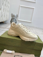 Gucci unisex sneakers in cream with side panel stitching and white lace-up front