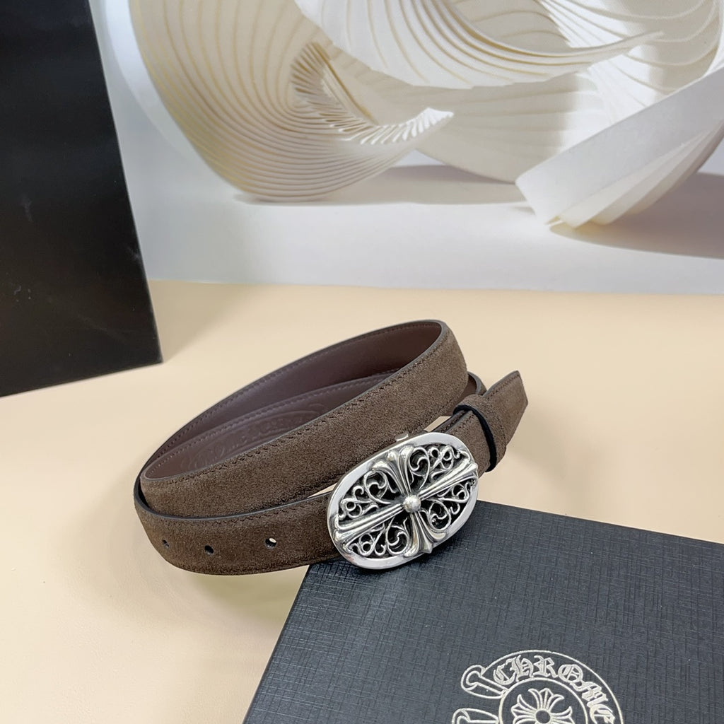 Brown leather belt with silver filigree buckle featuring a central flower motif.