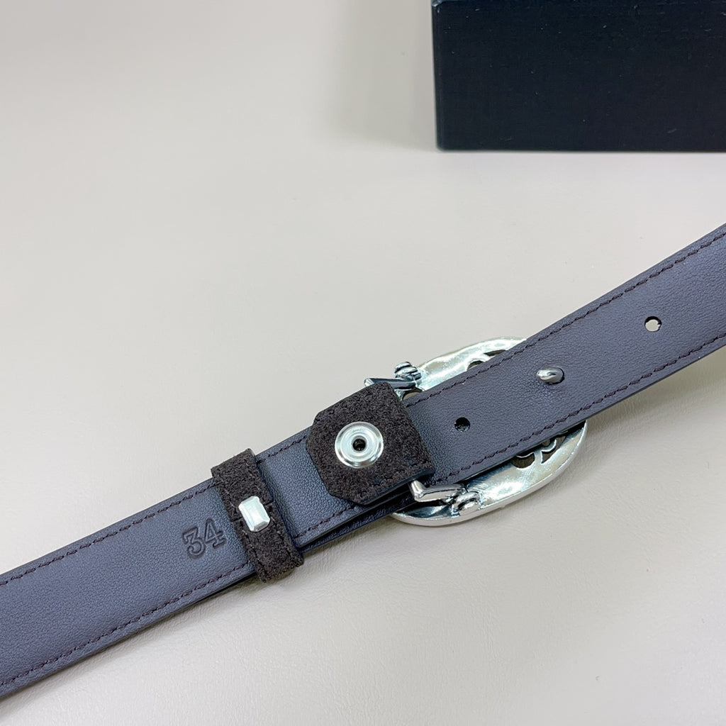 Dark blue leather belt with silver buckle hardware and metal strap keeper detail.