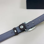 Dark blue leather belt with silver buckle hardware and metal strap keeper detail.