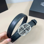 Chrome belt with dark blue leather strap and oval silver filigree buckle, held by hand