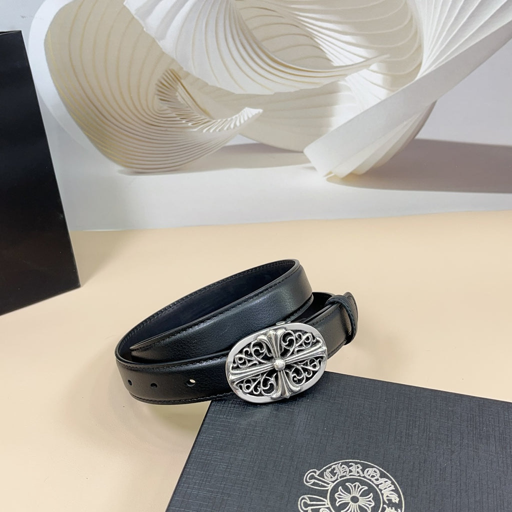 Chrome belt, dark blue leather strap with ornate oval silver buckle and short end view