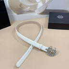Light blue belt laid flat with round silver floral buckle and stitched strap edge