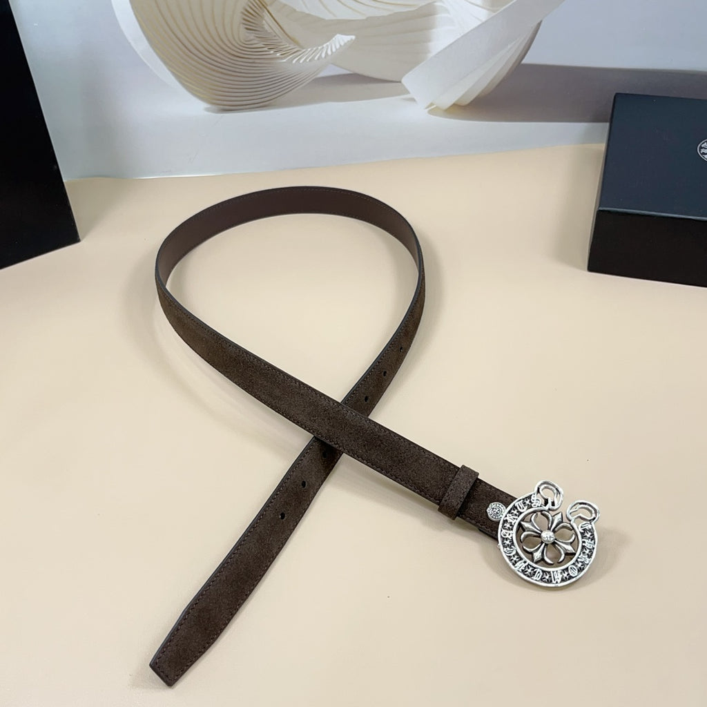 Dark brown belt with silver-toned circular floral buckle on strap