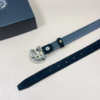 Chrome belt flat lay with blue strap, silver buckle and metal eyelets