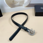 Black leather belt with silver-tone floral heart buckle and adjustable strap holes