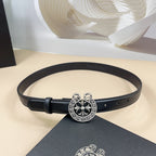 Black leather belt with silver-tone floral heart buckle and eyelet holes