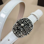 Close-up of light blue leather belt with ornate silver-tone oval buckle and rhinestone-style dots