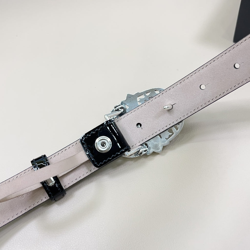 Chrome belt with light gray strap, silver buckle hardware and snap holes