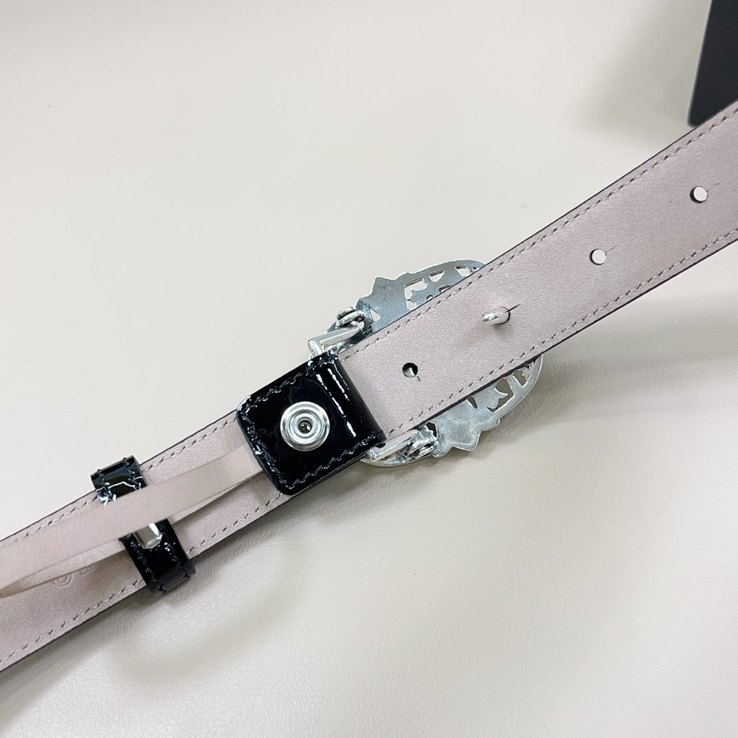 Chrome belt with light gray strap, silver buckle hardware and snap holes