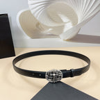 Chrome belt with dark leather strap and ornate silver buckle, front view