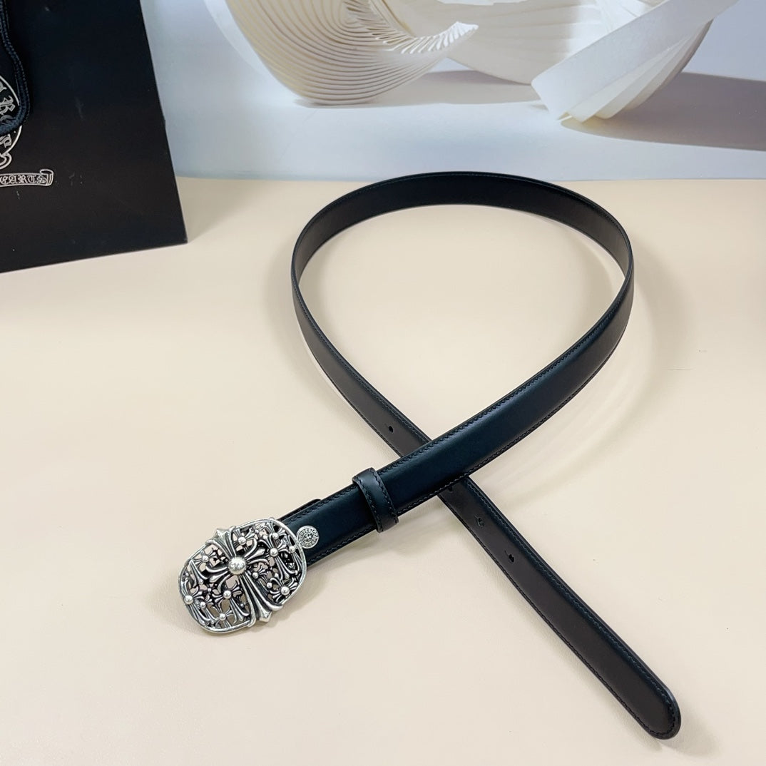 Chrome belt with dark leather strap and ornate silver buckle, laid out flat