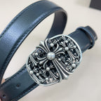 Dark blue leather belt with close-up ornate silver filigree buckle and round center