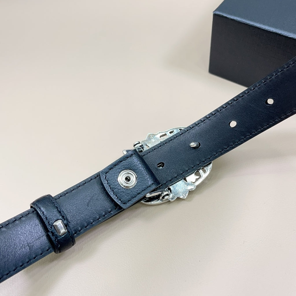 Dark blue leather belt end with metal pin buckle hardware and strap loops