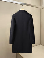 Black long coat with stand collar, center back seam, and buttoned sleeves