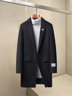 Long coat with notch lapels, button front, flap pockets, dark navy